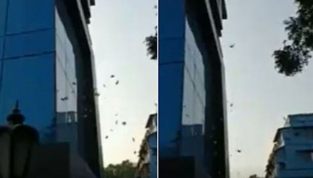 കൽക്കത്ത തെരുവിൽ കറൻസി നോട്ടുകളുടെ പെരുമഴ; ആളുകൾ ഓടി നടന്ന പെറുക്കിയത് അഞ്ഞൂറിന്റേയും രണ്ടായിരത്തിന്റേയും നോട്ടുകൾ; എൻഫോഴ്സ്മെന്റ് ഡയറക്ട്രേറ്റ് പരിശോധനയ്ക്ക് എത്തിയപ്പോൾ കൂറ്റൻ കെട്ടിടത്തിന്റെ മുകളിലത്തെ നിലയിൽ നിന്നും നോട്ടുകെട്ടുകൾ തെരുവിലേക്ക് എറിഞ്ഞ് കള്ളപ്പണക്കാർ; വൈറലായ വീഡിയോ കാണാം